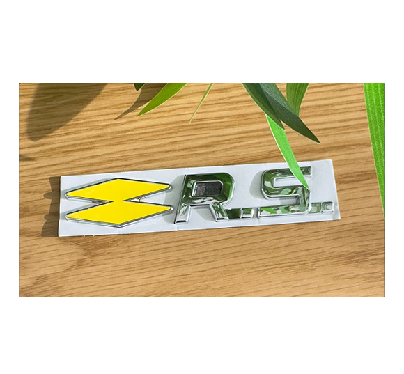 Monogramme arrière Renault Sport chrome et jaune